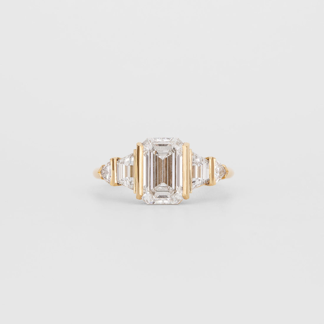 Emerald cut lab grown diamond bar set five stone deco ring in yellow gold