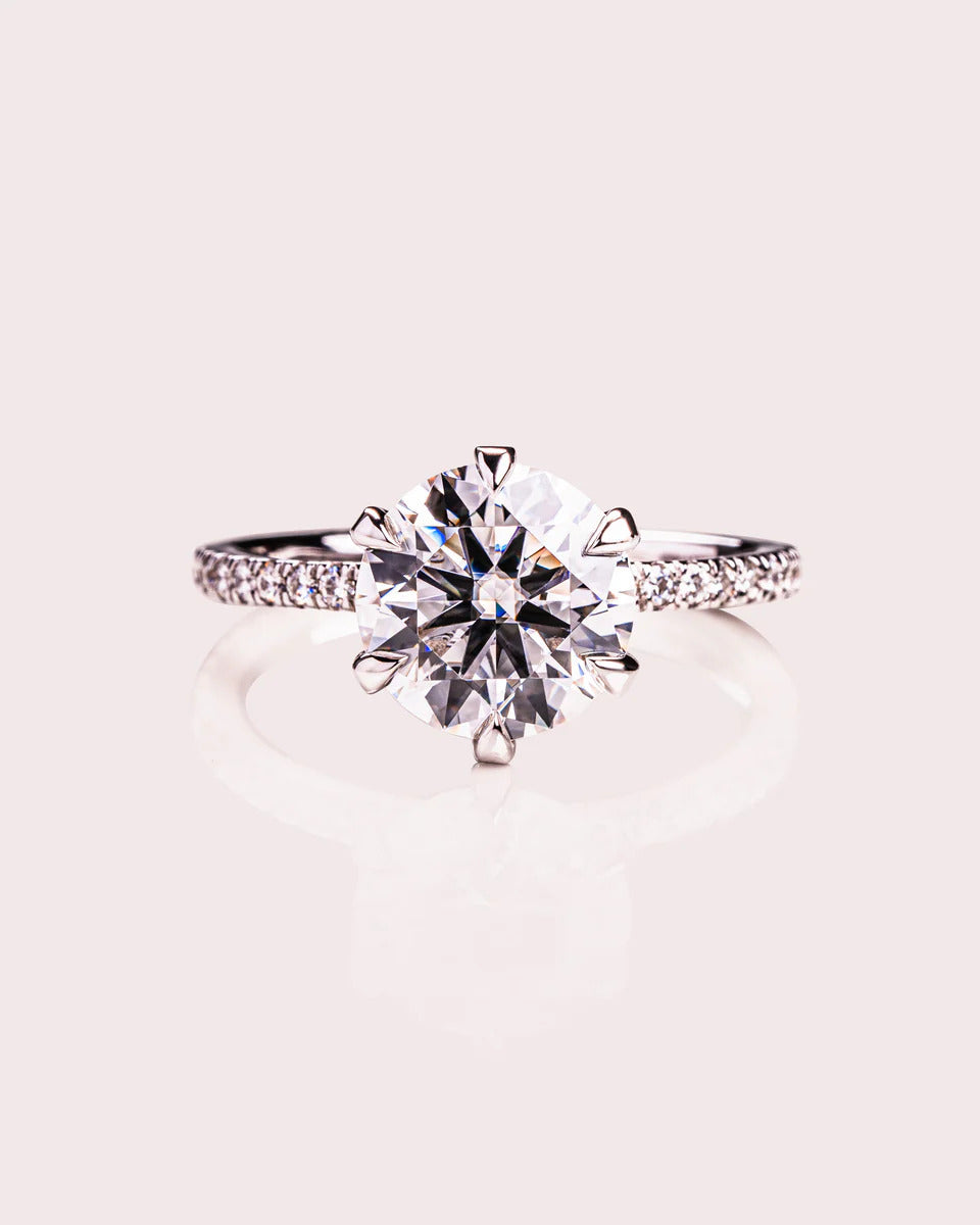 Round brilliant cut moissanite solitaire engagement ring in gold