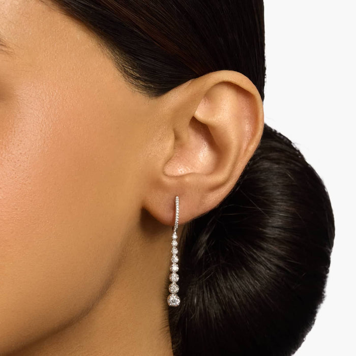 Round Cut Moissanite Graduated Drop Earrings - view 2