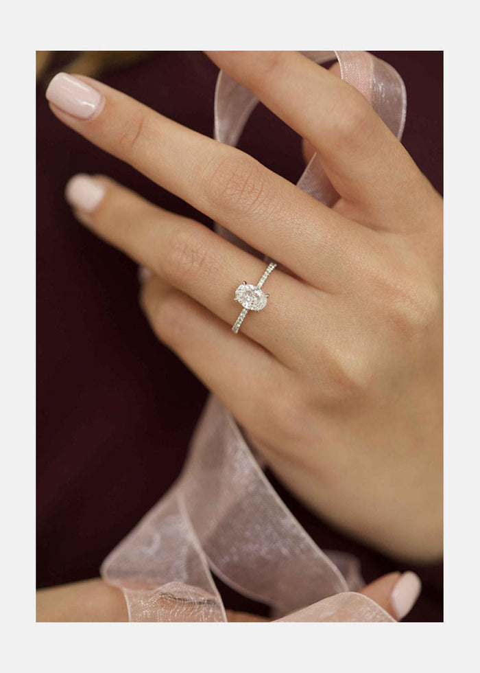 Oval Cut Moissanite Hidden Halo Slim Pave Band Engagement Ring - on hand view 1