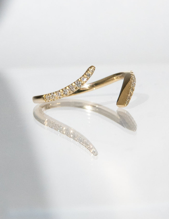 Gold open wrap pave band with moissanite on both tapered ends, side view