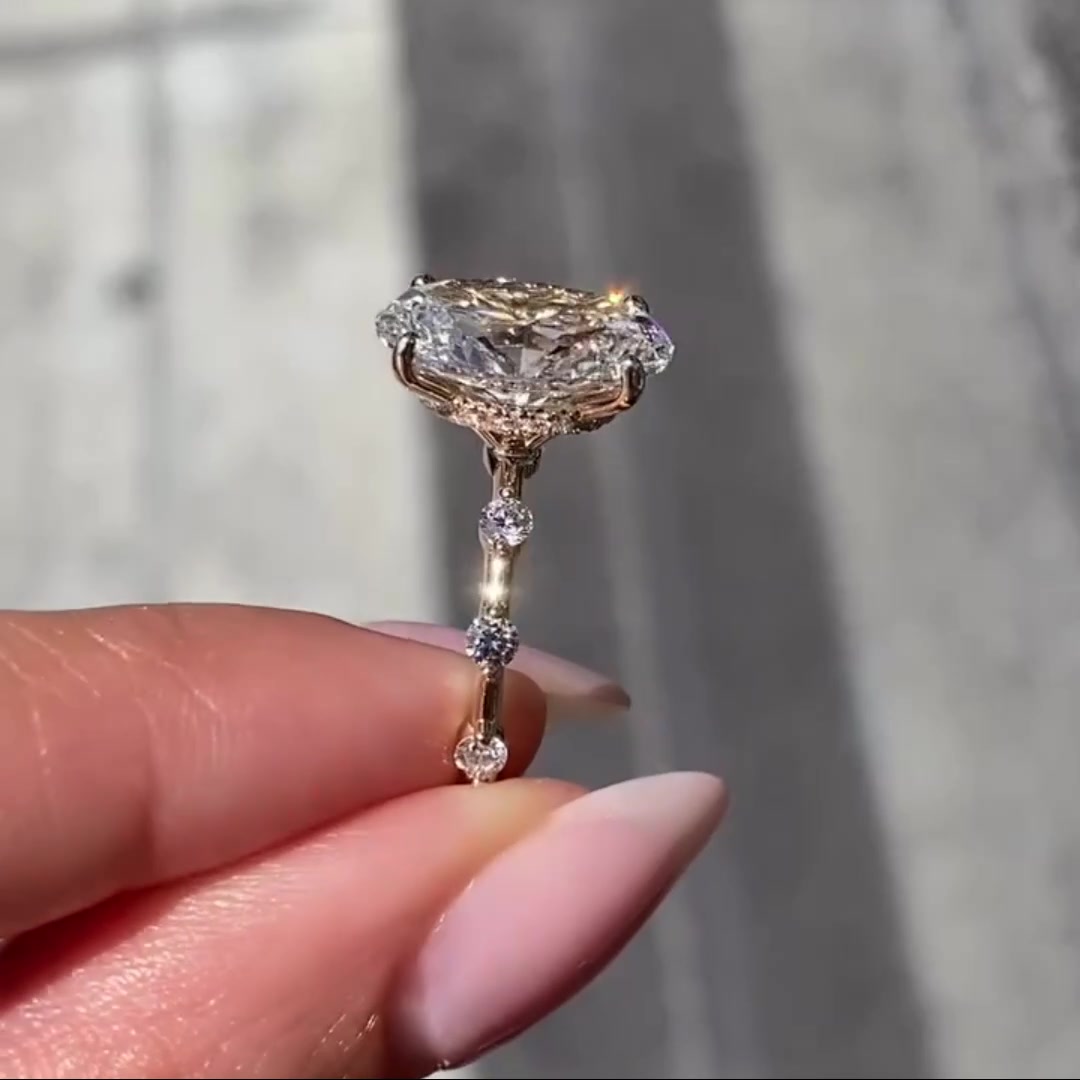 Oval moissanite engagement ring with hidden halo and pave eternity band in gold