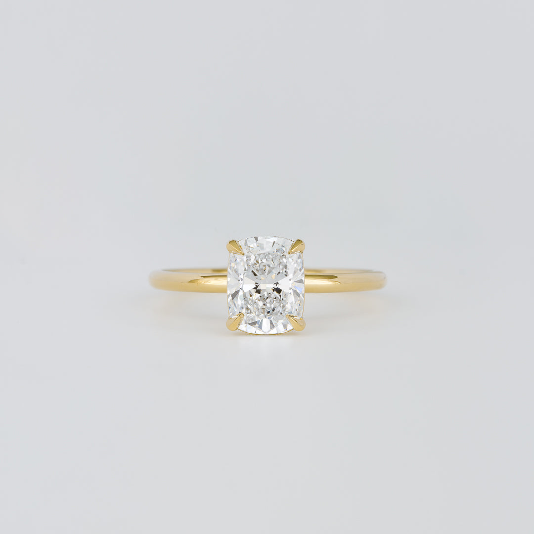 Elongated cushion cut lab grown diamond four claw solitaire ring in yellow gold