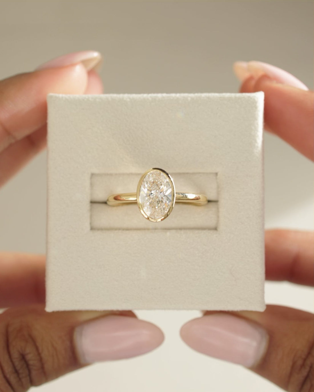 Oval Cut Moissanite Bezel Set Solitaire Engagement Ring with Polished Band - view 1