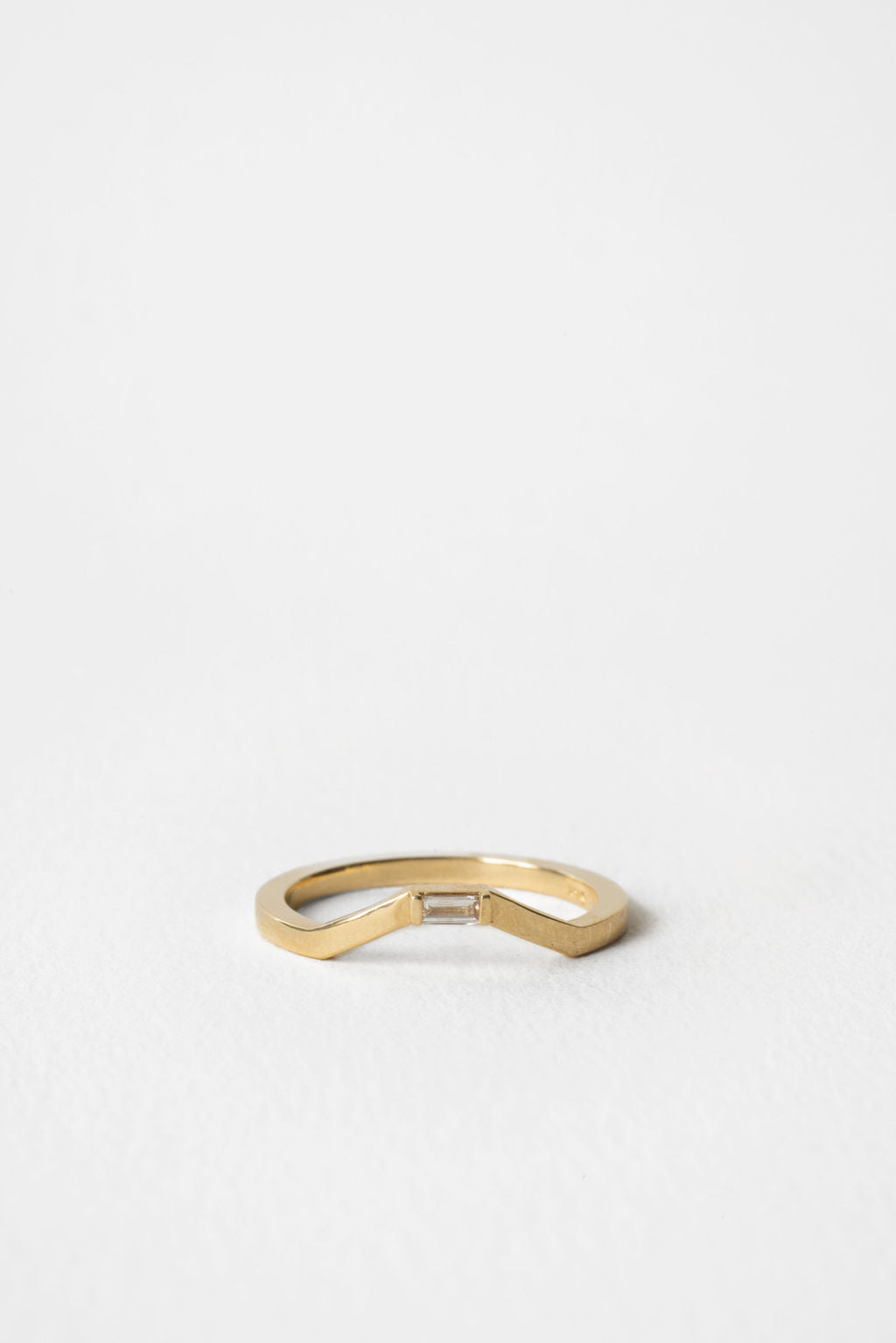Baguette lab grown diamond curved wedding band 0.05 CT TW in yellow gold, front view