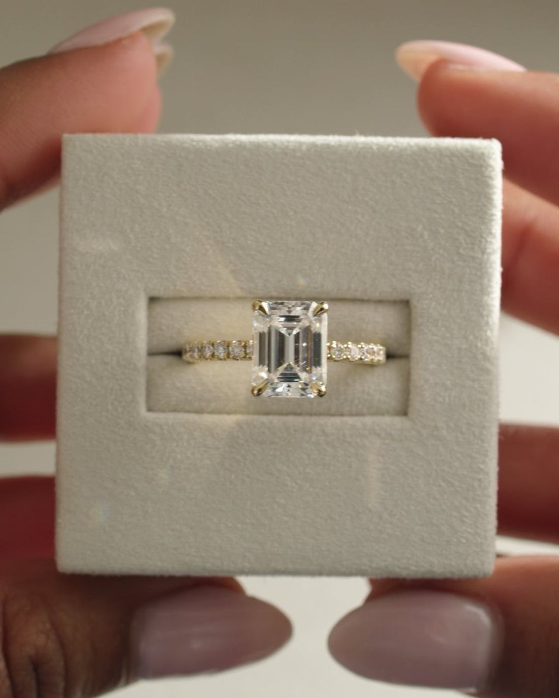 Emerald Cut Moissanite Four Claw Engagement Ring with Round Pave Band - view 1