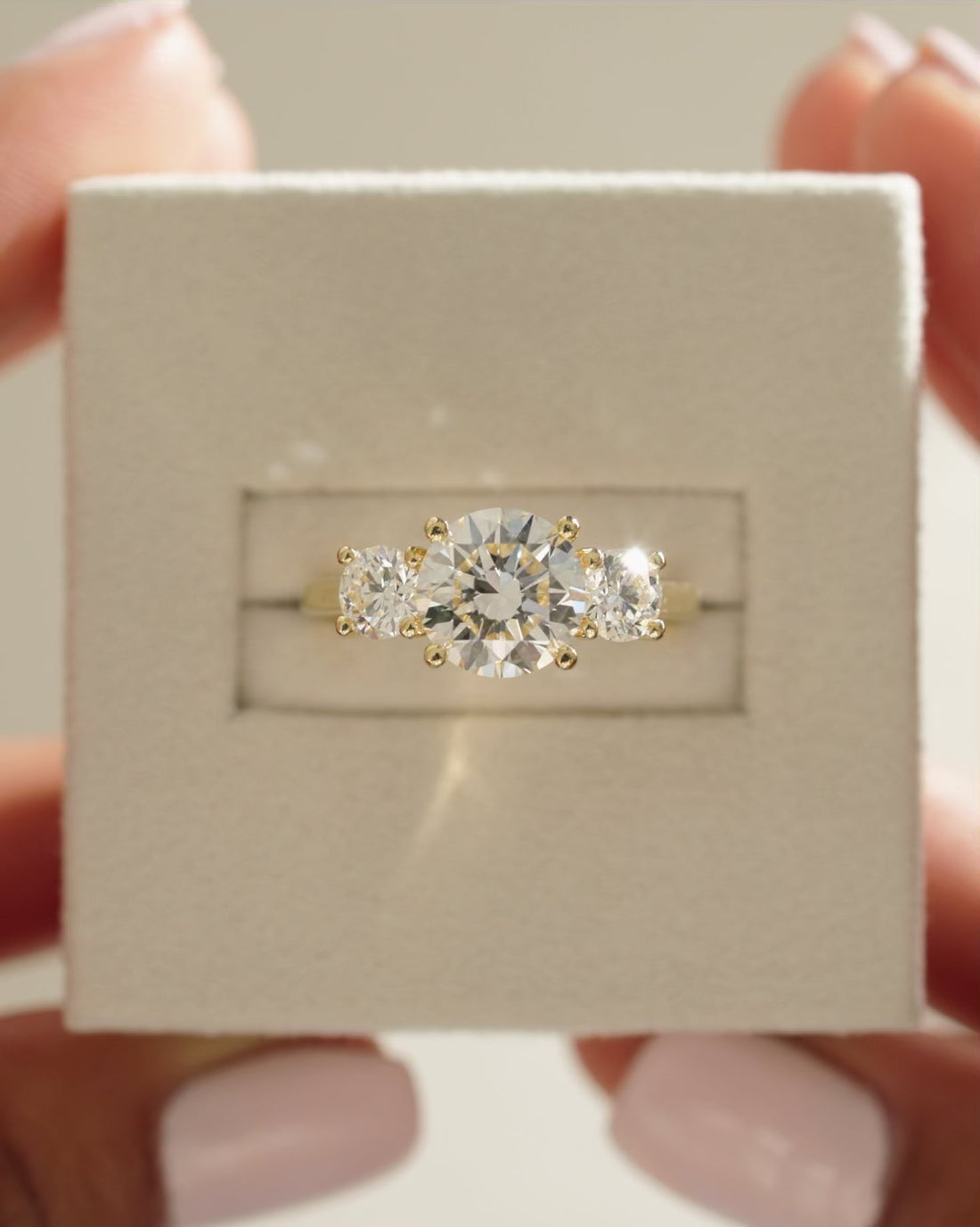 Round Cut Moissanite Classic Three Stone Engagement Ring with Four Claw Settings - view 1