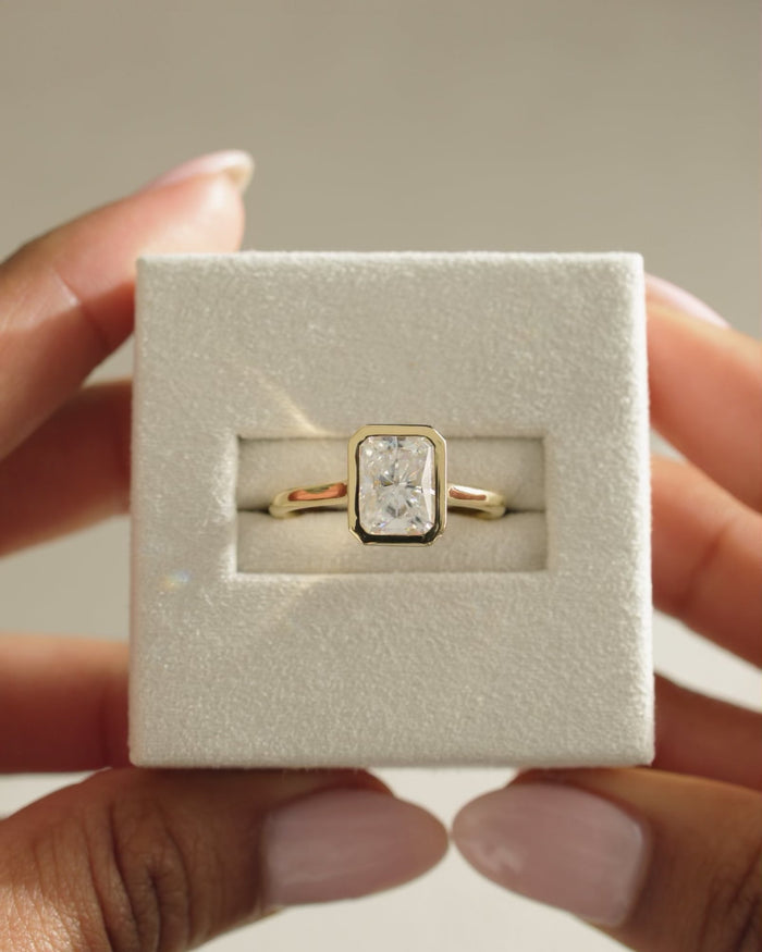 Radiant Cut Moissanite Bezel Set Solitaire Engagement Ring with Polished Gold Band - view 1
