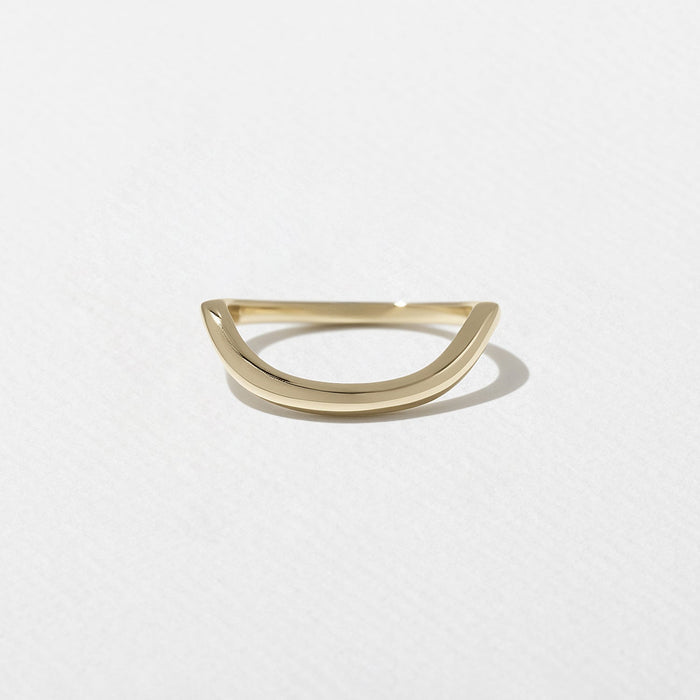 Curved plain wedding band in yellow gold front view