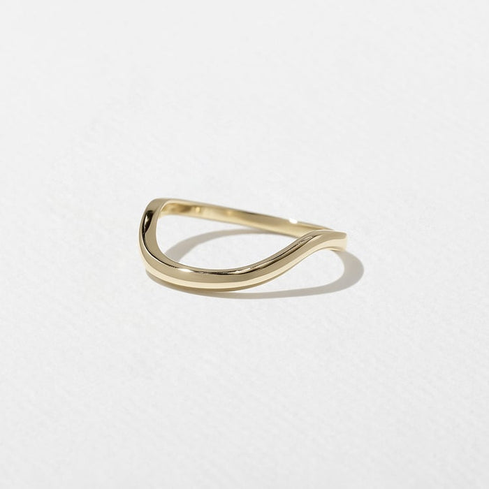 Angled view of the plain curved wedding band