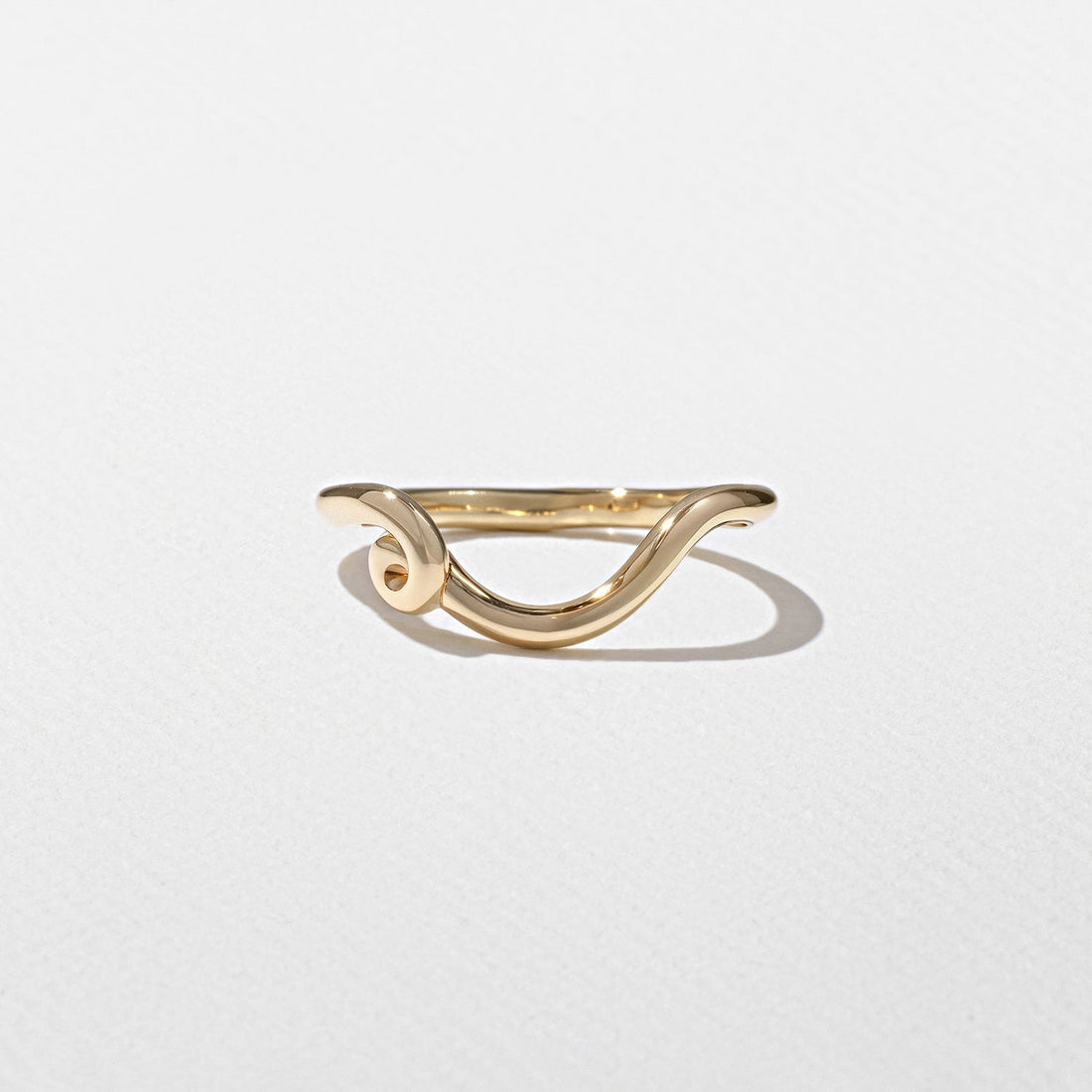 Curved scroll wedding band in yellow gold front view