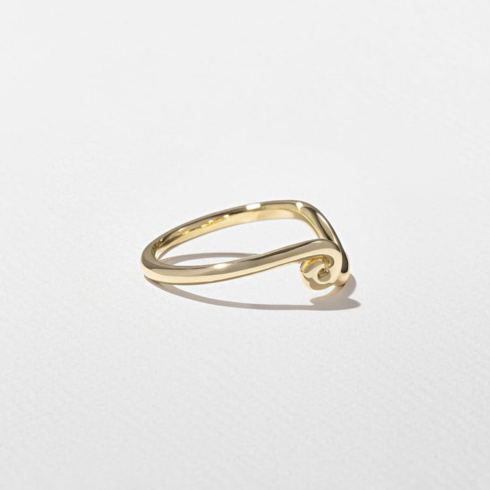 Angled view of the curved band with a curled scroll end