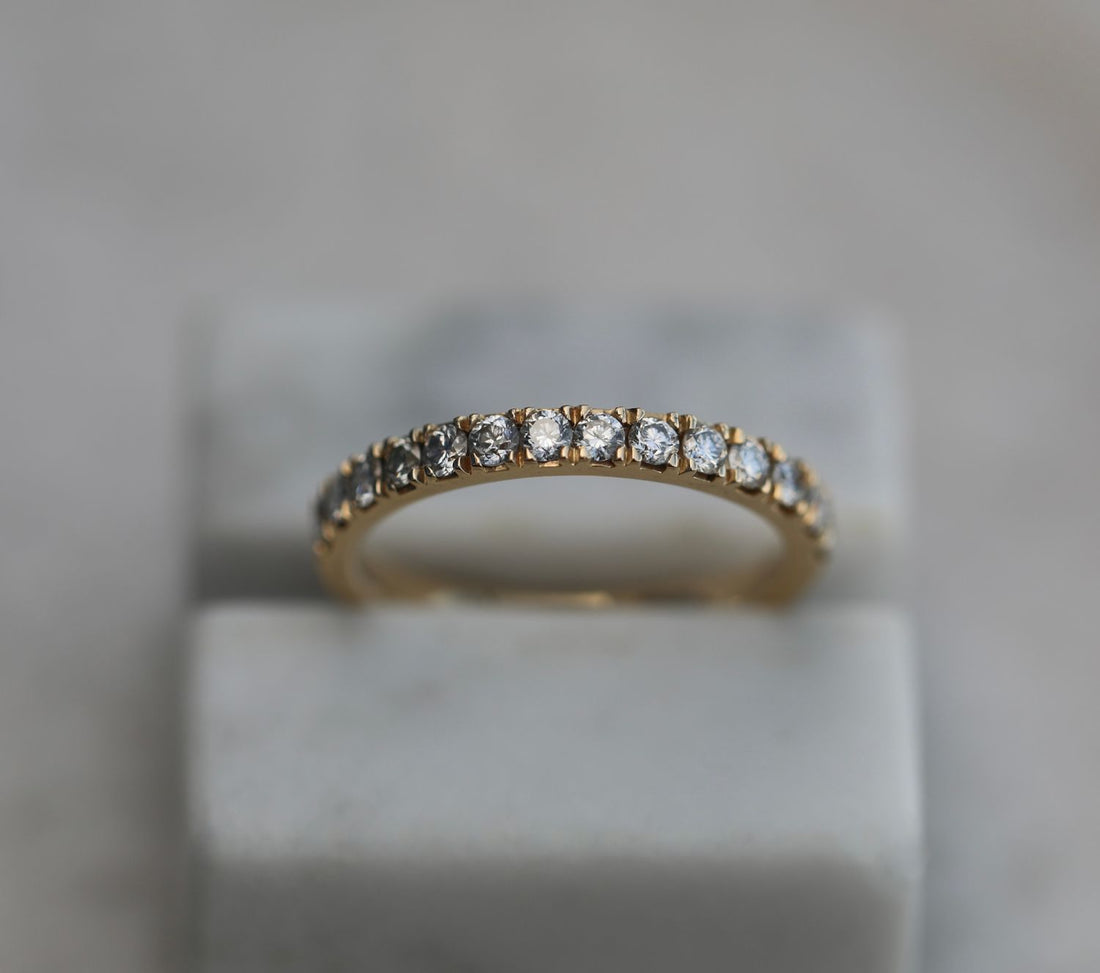 Round shared prong half eternity lab grown diamond wedding band in yellow gold, front view