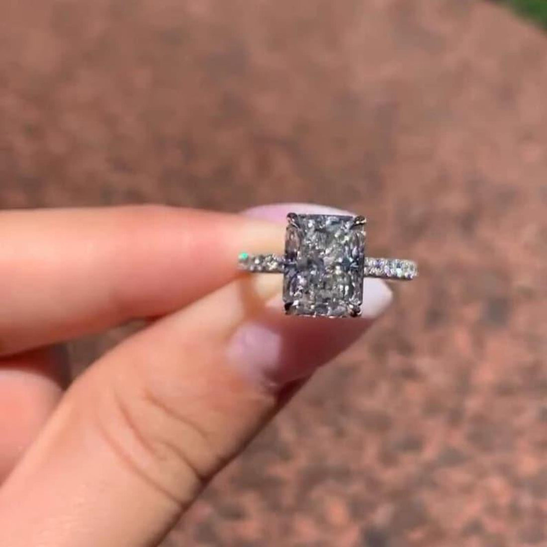 Radiant cut lab grown diamond hidden halo ring with pave band