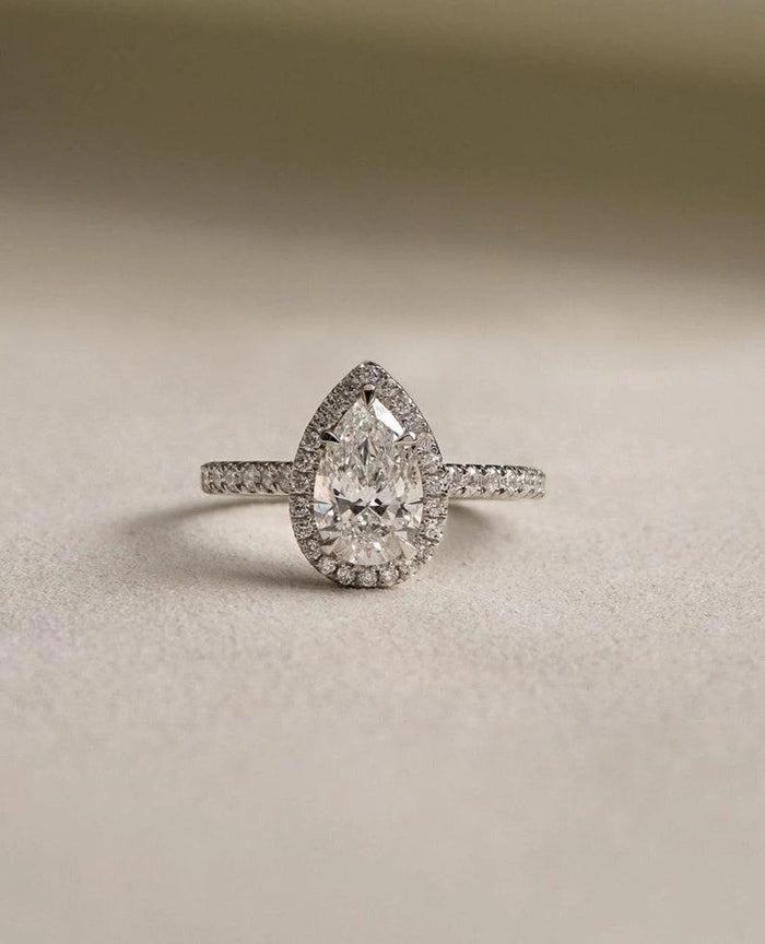 Pear cut lab grown diamond halo ring, detail of the pave set band