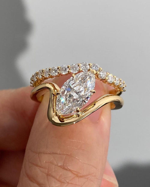 Marquise cut lab grown diamond bridal ring set with bezel setting and pave eternity band in yellow gold