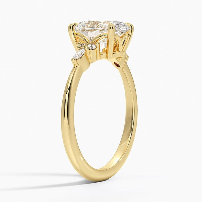 Profile view of the oval diamond cluster shoulder ring showing the slim tapered plain band