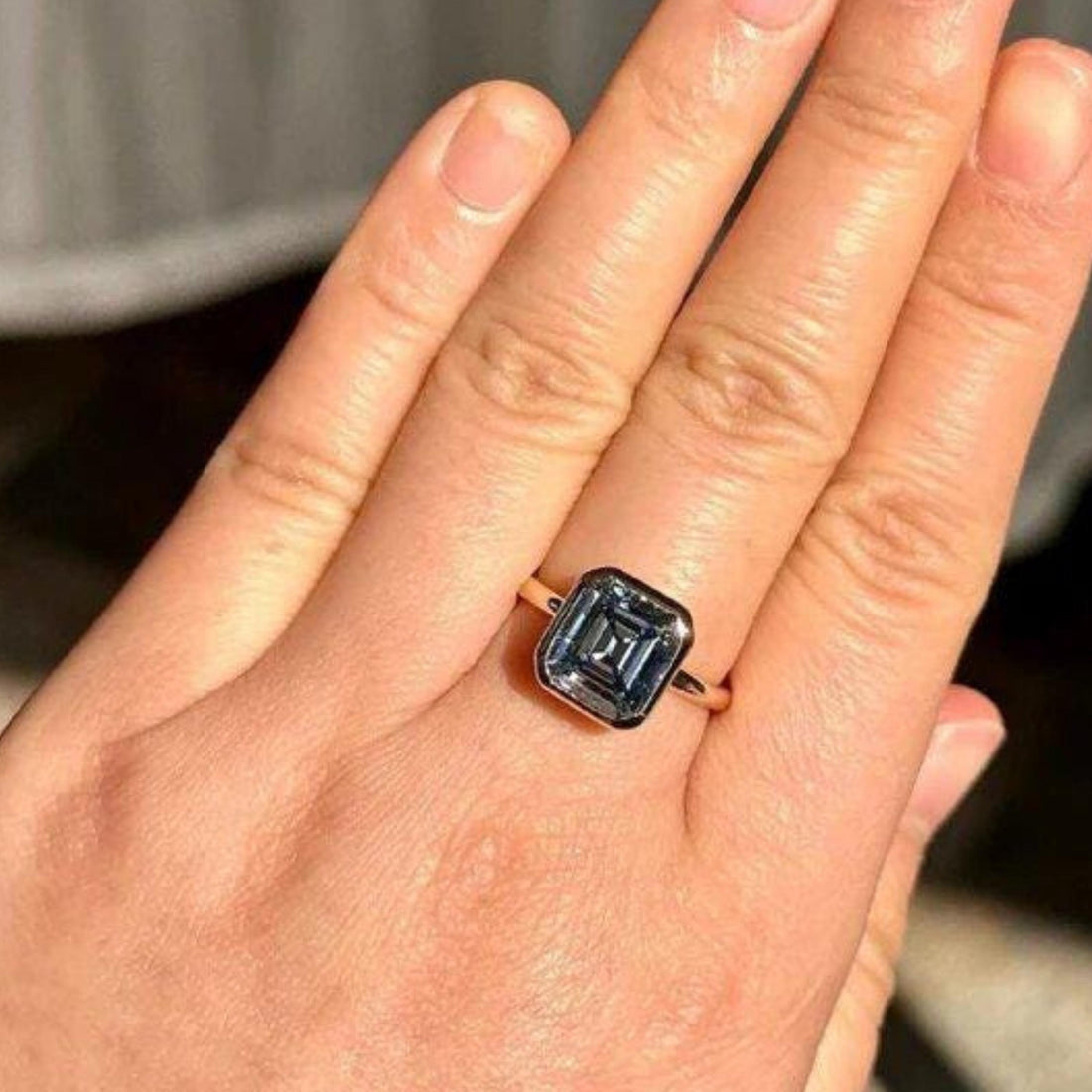 Blue Asscher cut lab grown diamond bezel set solitaire ring