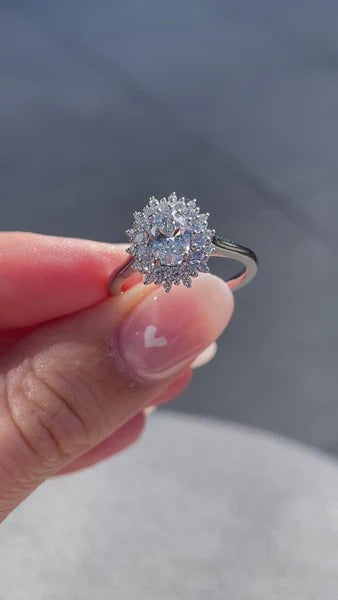 Cathedral oval cut diamond halo engagement ring