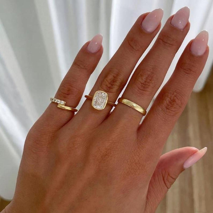 Elongated cushion cut lab grown diamond bezel ring angled view