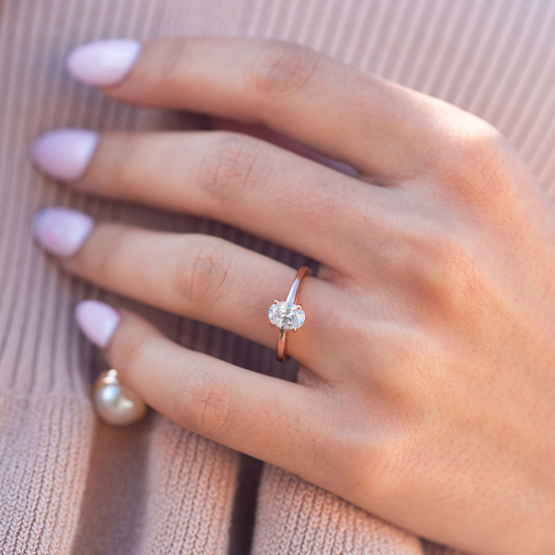 Oval lab grown diamond classic four claw solitaire engagement ring