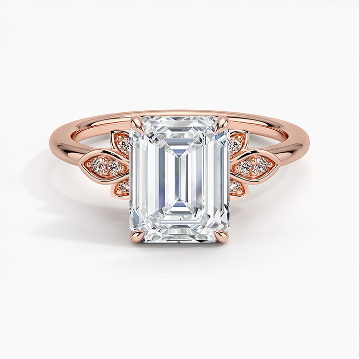 Emerald cut lab grown diamond ring in rose gold with pave set leaf clusters at the shoulders, top view