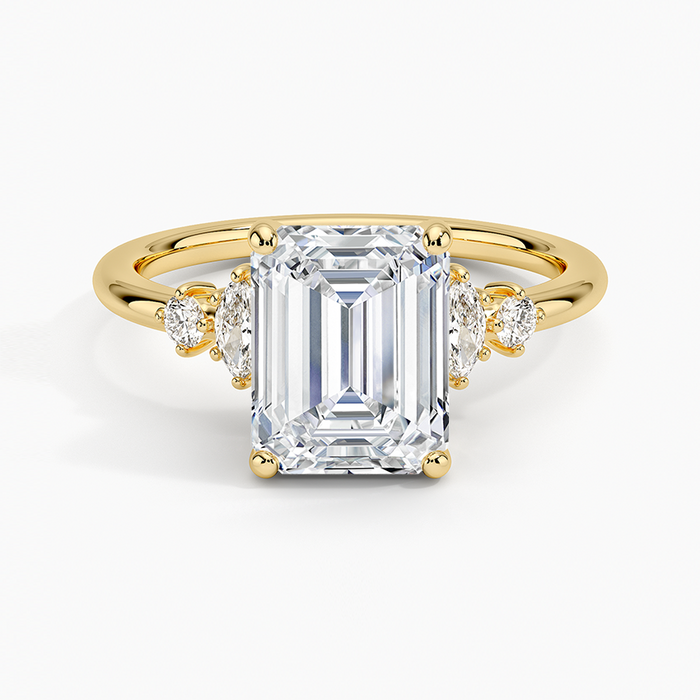 Emerald cut lab grown diamond ring with marquise and round five stone accents in yellow gold, top view