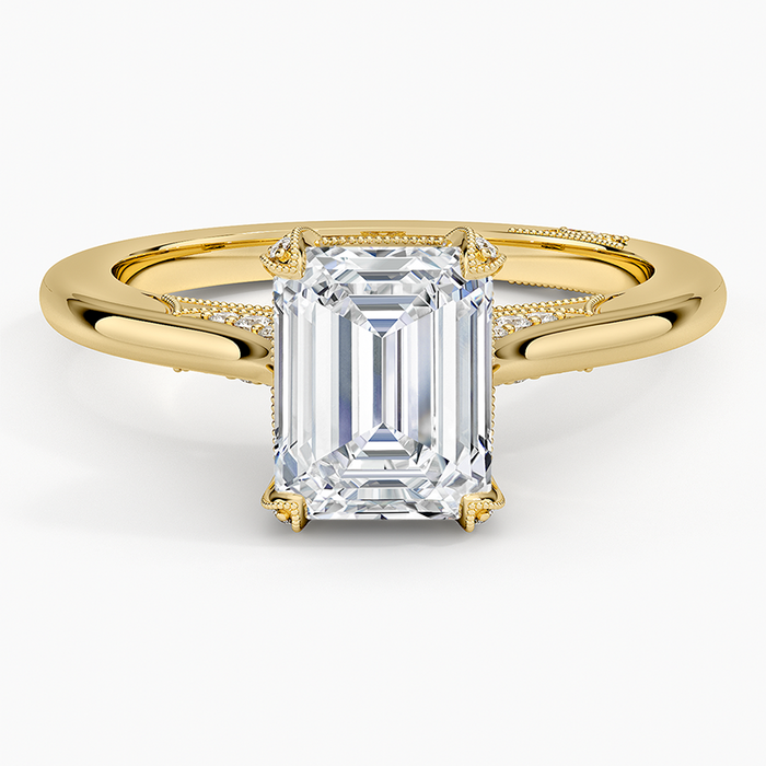 Emerald cut lab grown diamond ring with split shank in yellow gold, top view