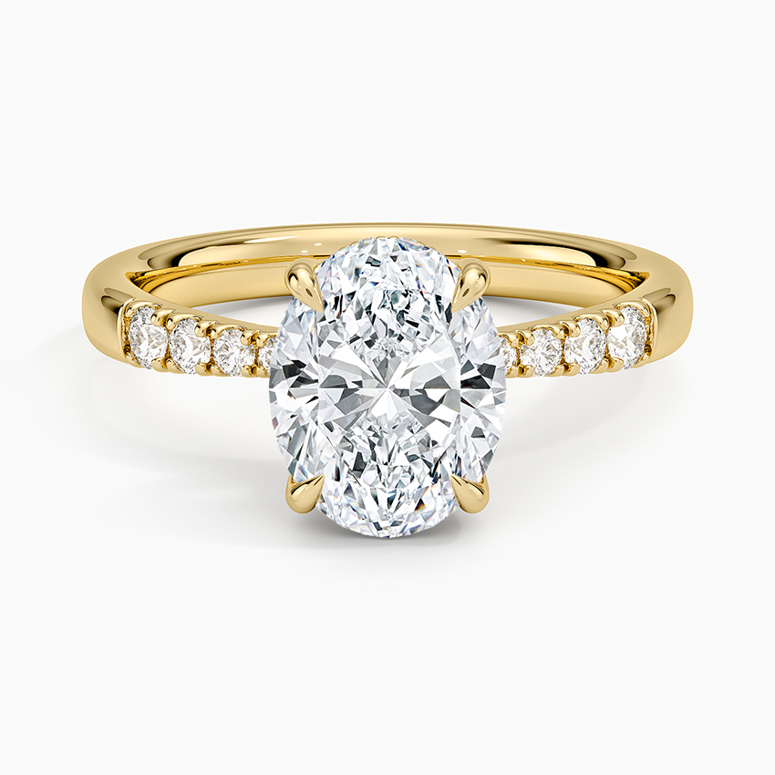 Oval cut lab grown diamond ring with squared hidden halo and graduated crest pave in yellow gold, top view