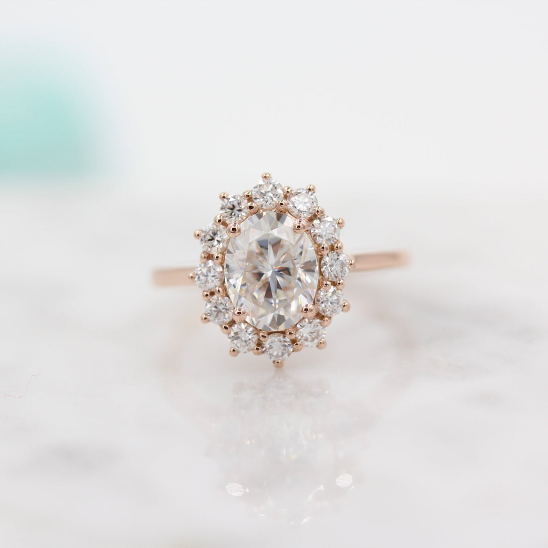 Oval lab grown diamond floral halo engagement ring