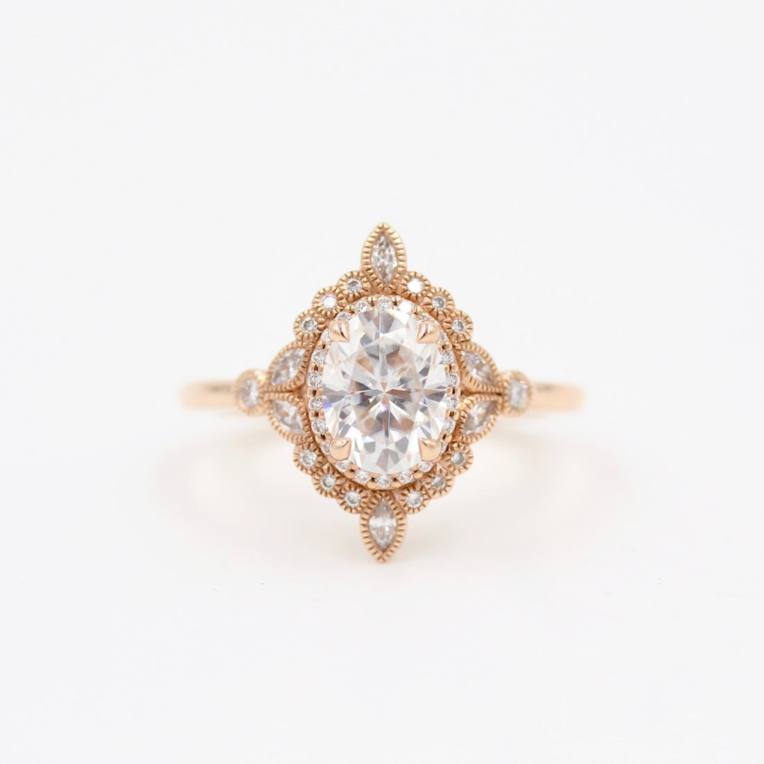 Oval lab grown diamond compass star halo engagement ring