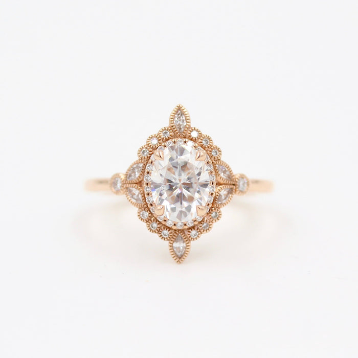 Oval lab grown diamond compass star halo engagement ring