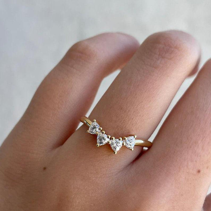 Trilliant side stones flanking the pear cut lab grown diamond centre