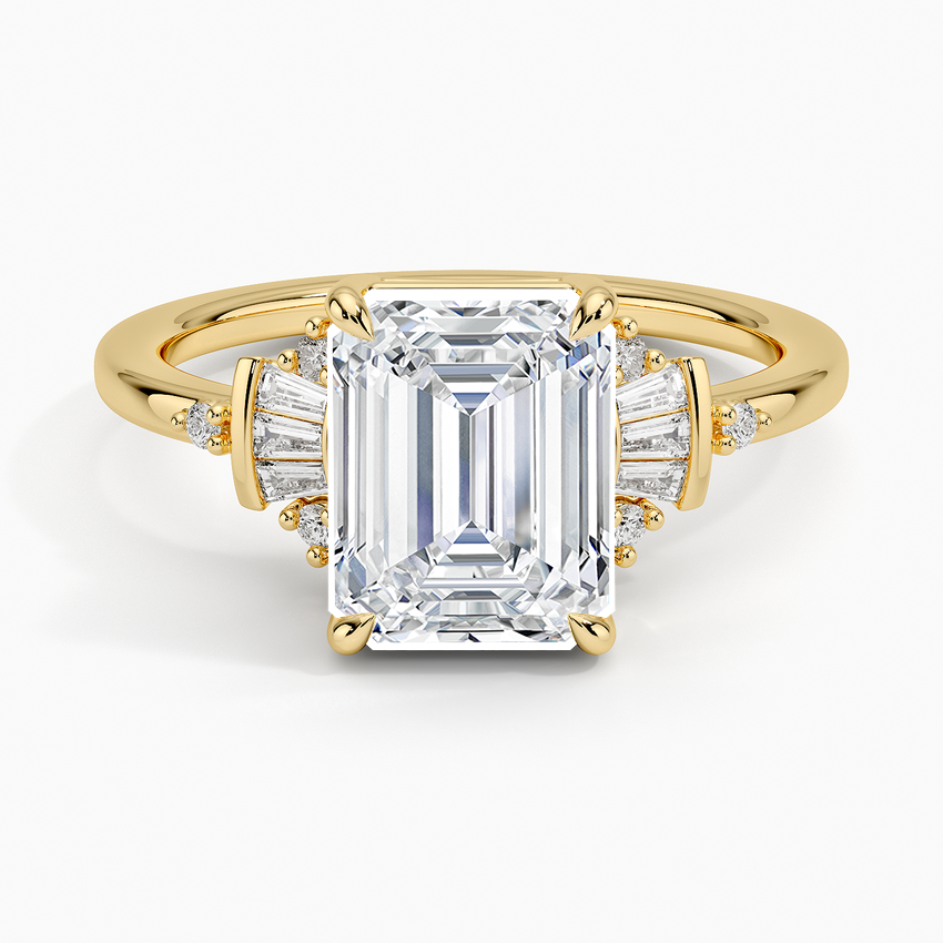 Emerald cut lab grown diamond ring in yellow gold with stacked baguettes and round accents at the shoulders, top view