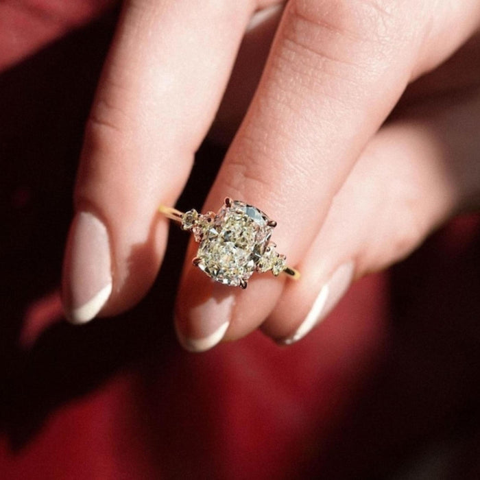 Five graduated cushion cut lab grown diamonds set in a line