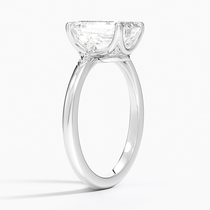 Side profile showing the engraved laurel leaf pattern on the slim band