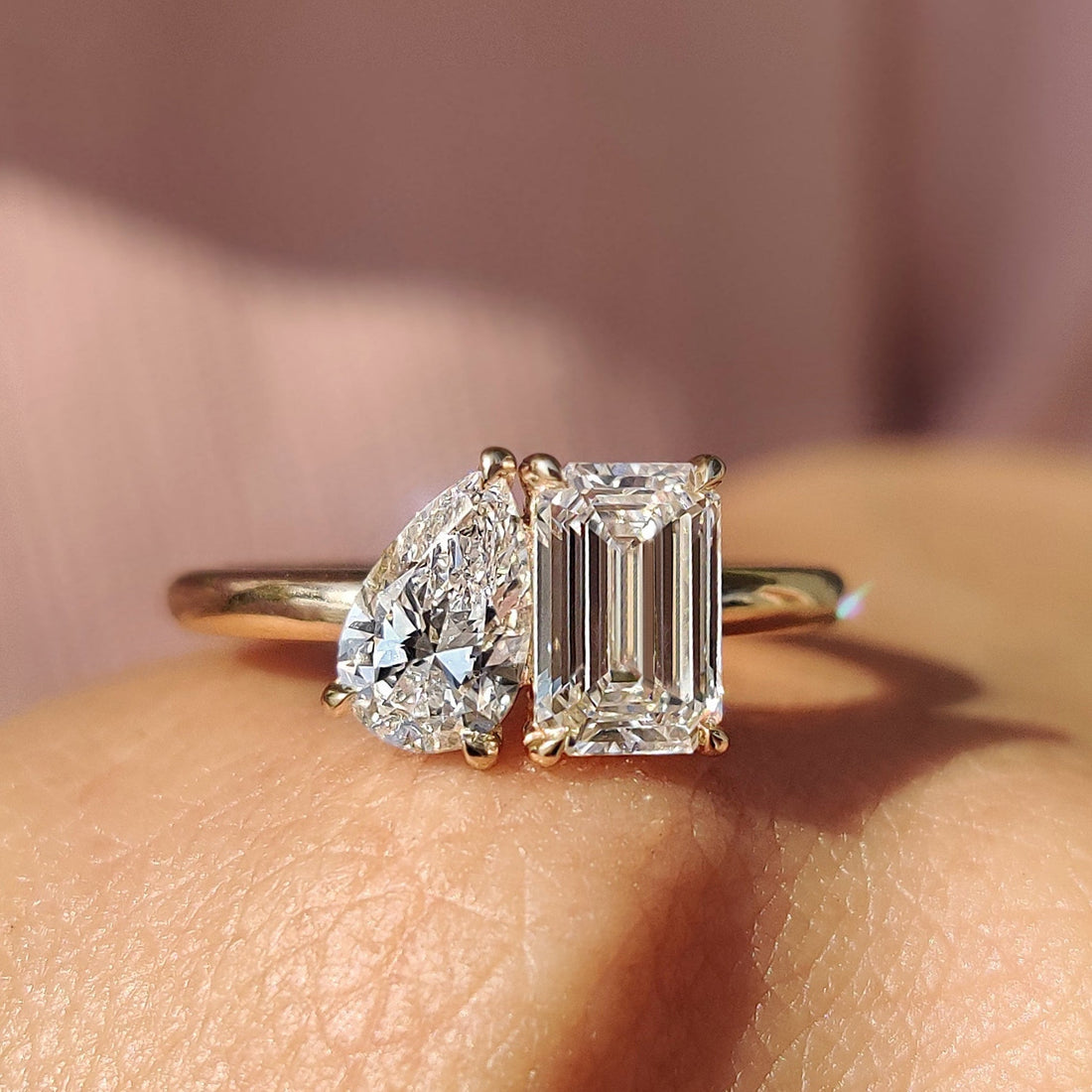 Pear and emerald cut lab grown diamond toi et moi ring
