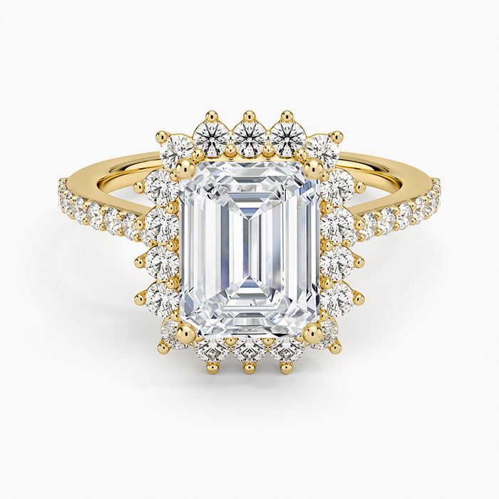 Emerald cut lab grown diamond ring in yellow gold with beaded prong halo and pave shoulders, top view