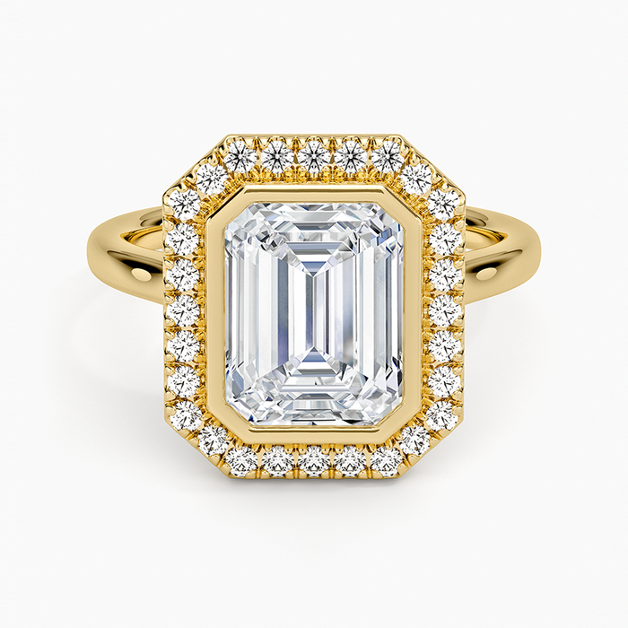 Emerald cut lab grown diamond ring in yellow gold with full bezel and pave halo, top view