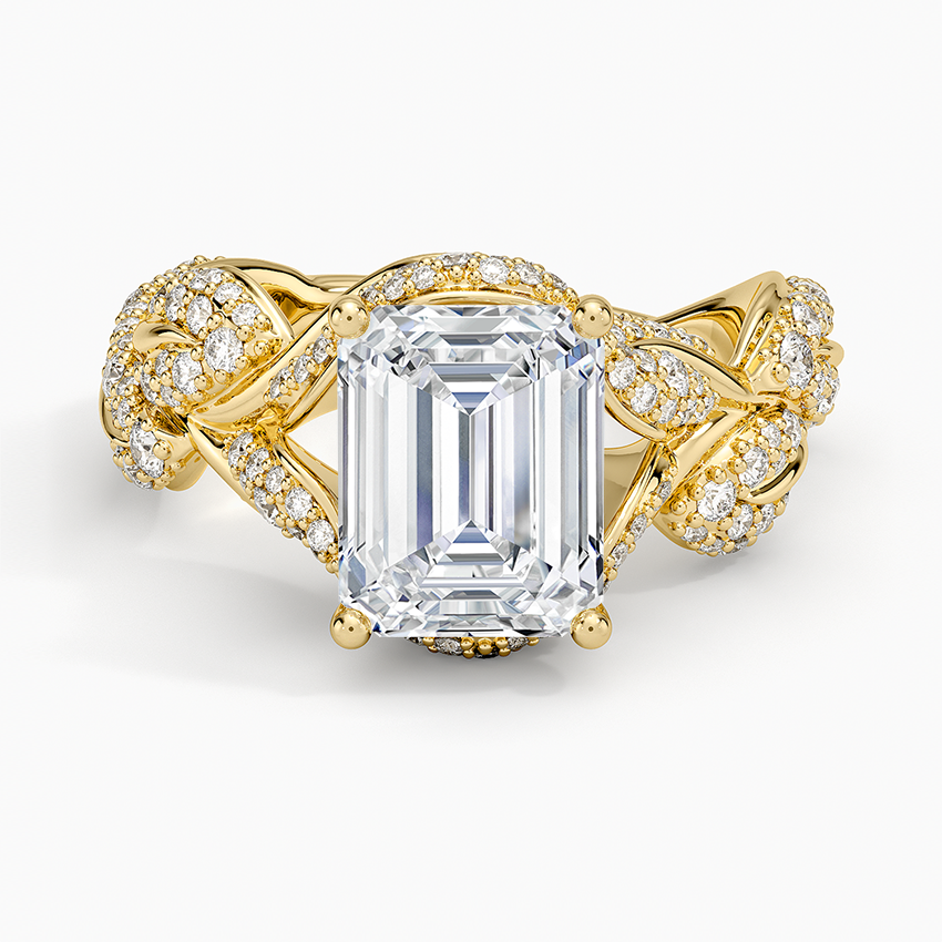 Emerald cut lab grown diamond ring in yellow gold with braided pave vine and pave leaf shoulders, top view