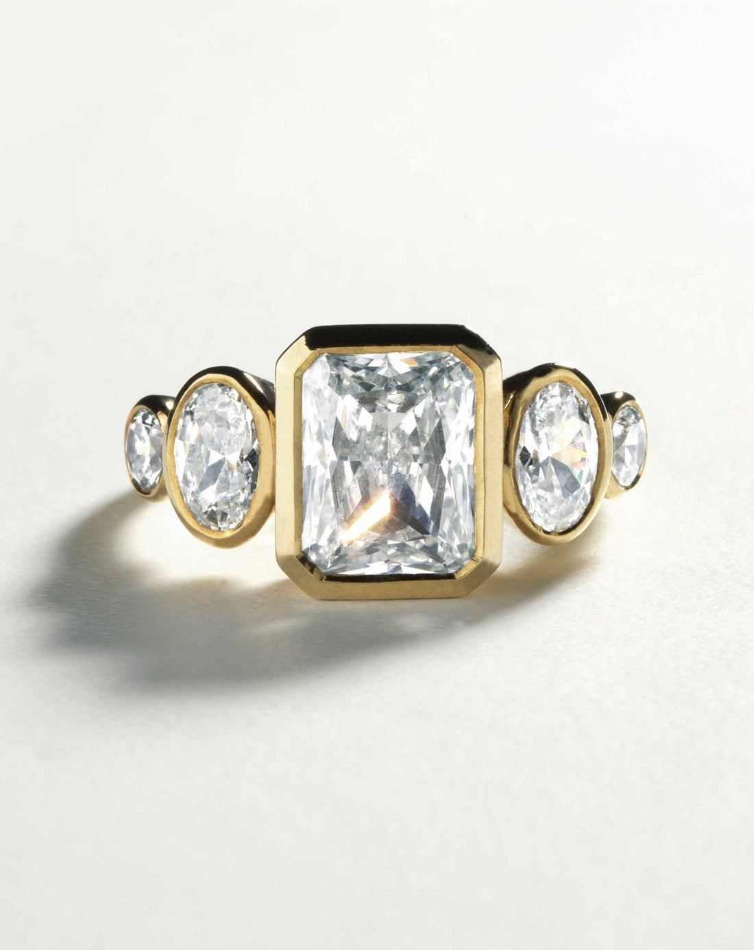 Radiant cut lab grown diamond five stone bezel engagement ring