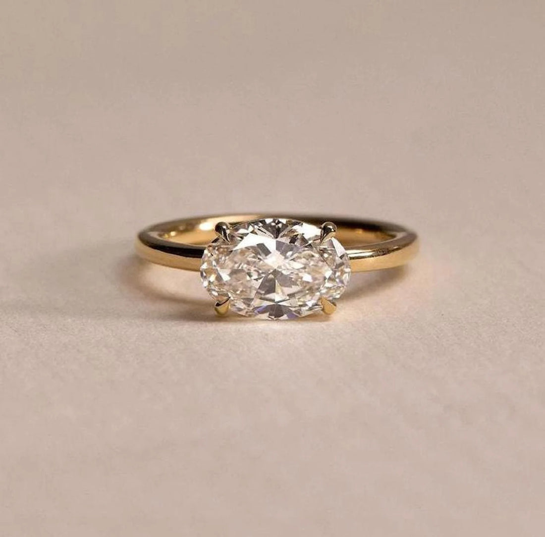 East west oval cut lab grown diamond solitaire engagement ring in yellow gold