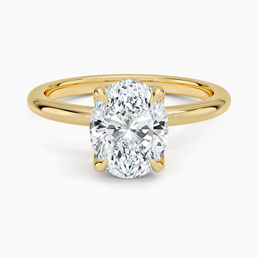 Oval cut lab grown diamond solitaire ring with tulip basket setting in yellow gold, top view