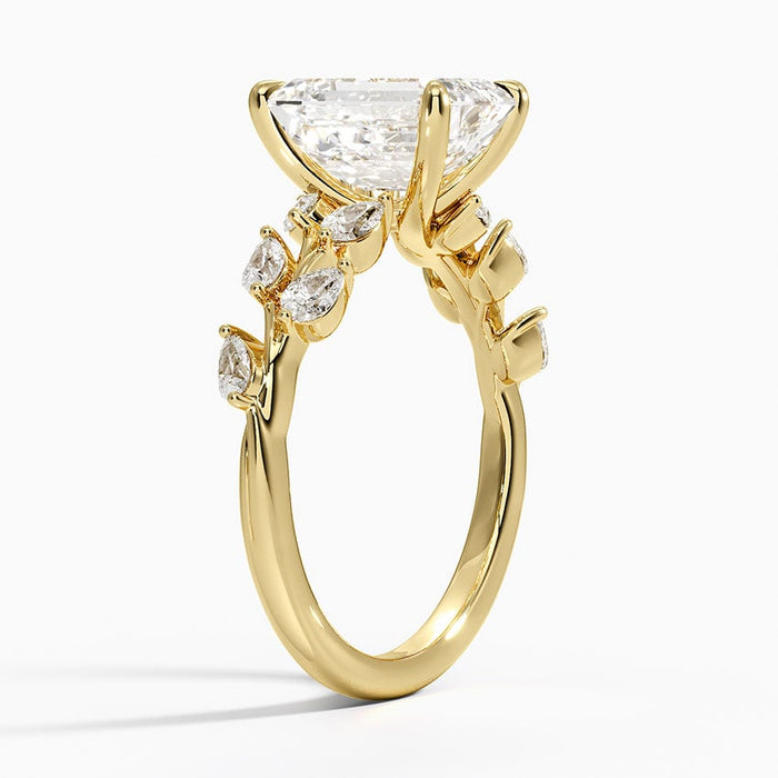 Side profile of the emerald cut lab diamond vine ring showing marquise leaves and tapered polished band