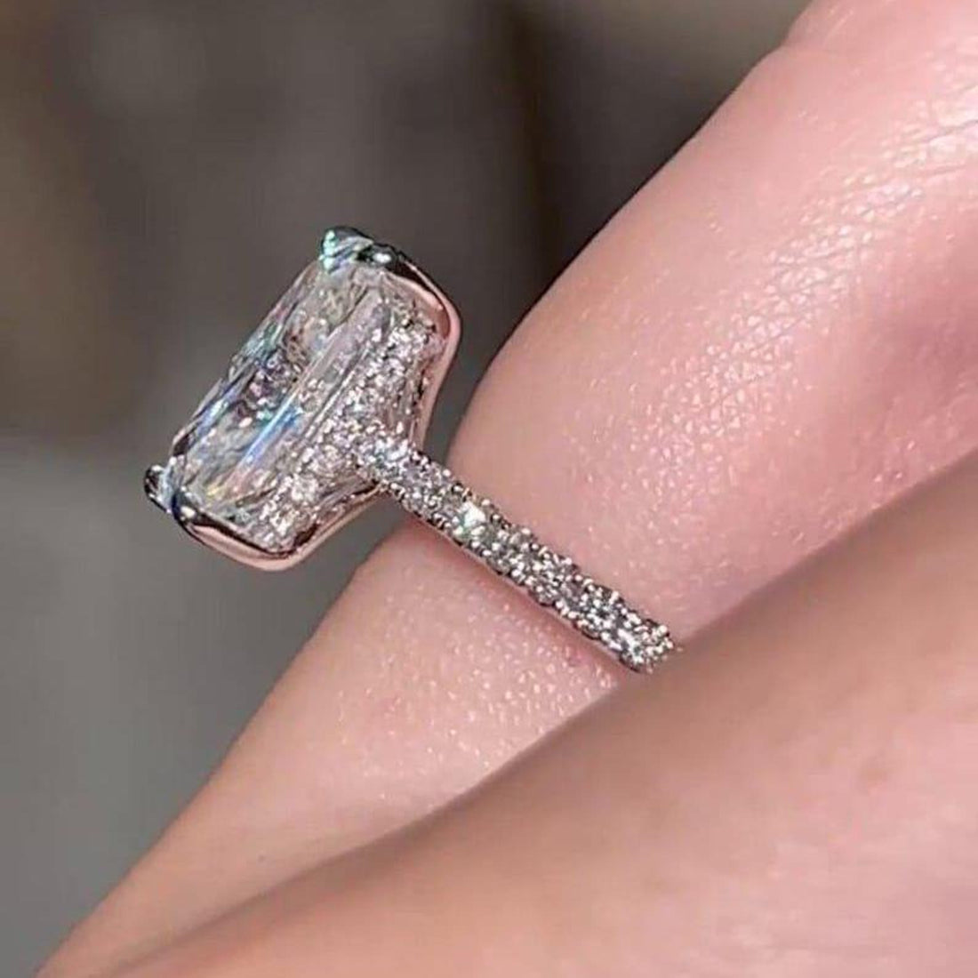 Radiant cut lab grown diamond pave engagement ring on hand