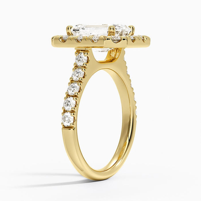 Profile view showing the halo frame and the shared prong diamonds along the shoulder