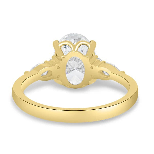 Oval diamond trilogy ring with round and pear side stones