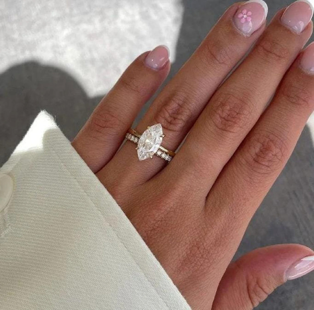 Marquise cut lab grown diamond engagement ring with pave band in yellow gold