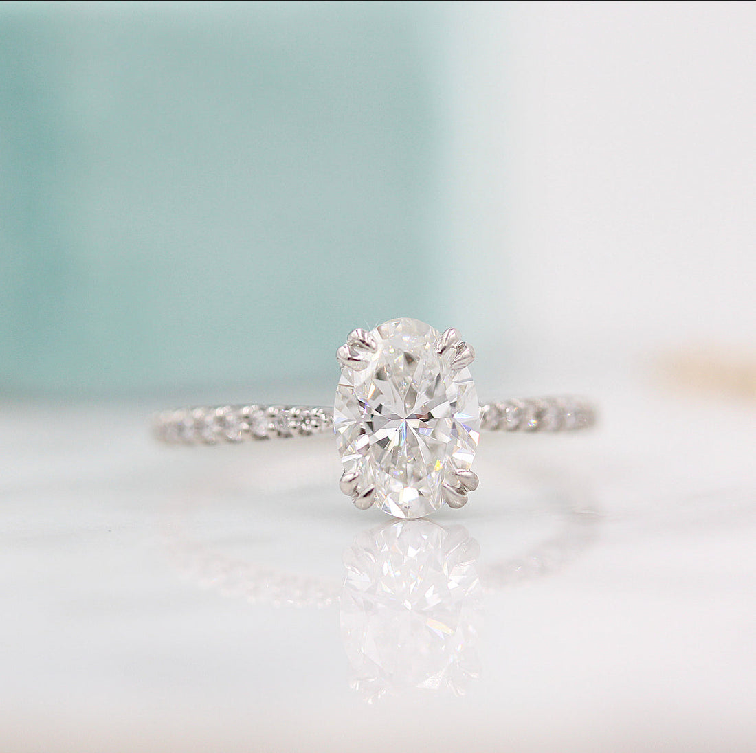 Oval lab grown diamond double claw pave engagement ring