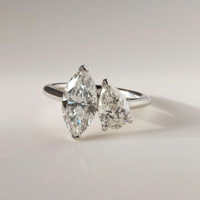 Toi et moi marquise and pear cut lab grown diamond engagement ring in white gold